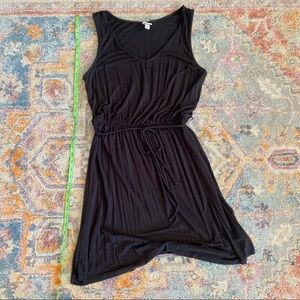 Black sleeveless dress with tie waistline
